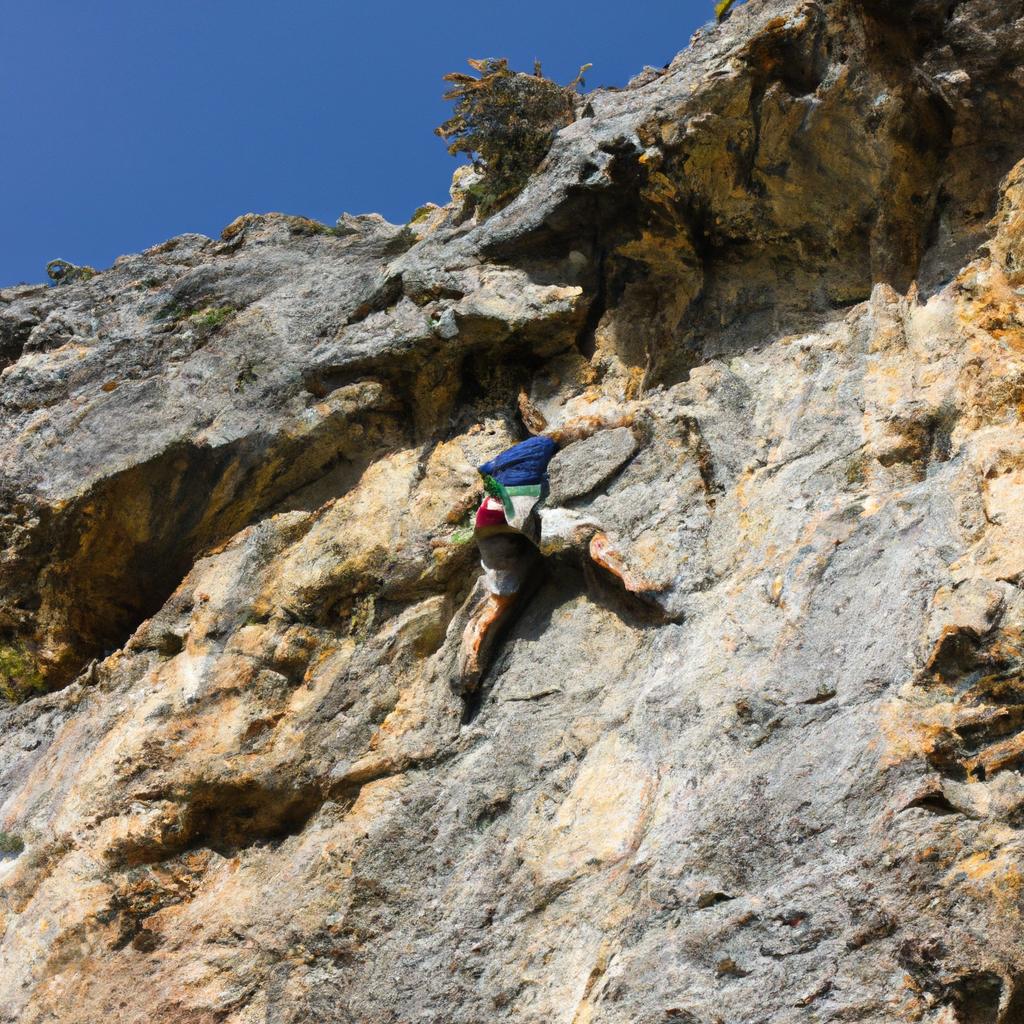 Person rock climbing on cliff
